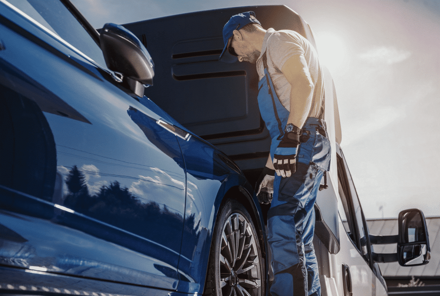 man loading car transport